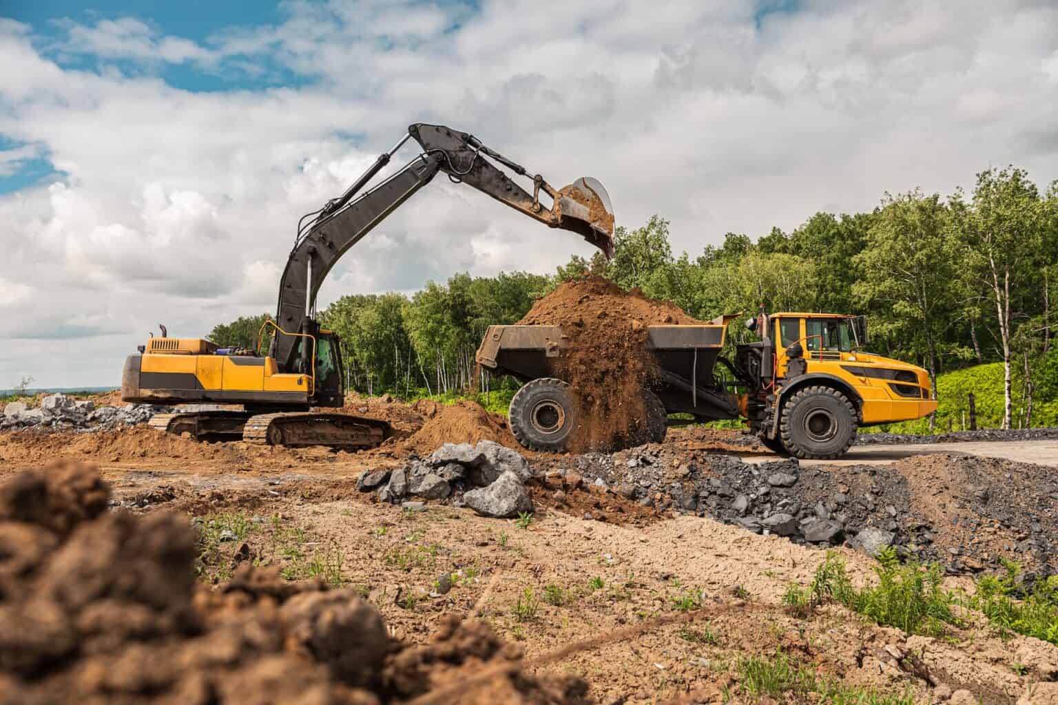 Excavator Loading Volvo Truck